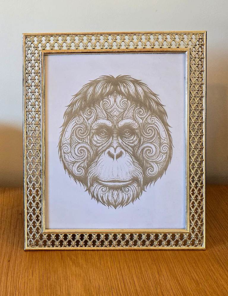 Laser engraved orangutan in an ornate frame