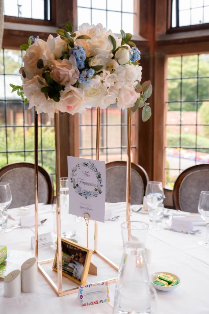 4 Gold Centrepiece Stands with real touch artificial flowers arrangements 