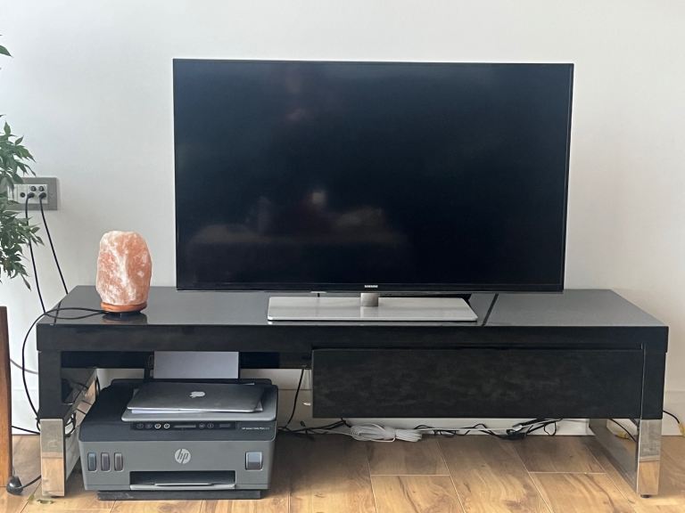 image for Samsung Medium size TV and a black modern style stand to go with it