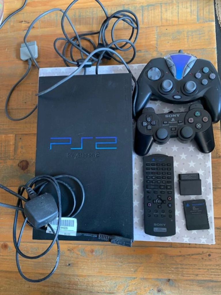 PlayStation 2 bundle, plus sing star microphones and 4 games 