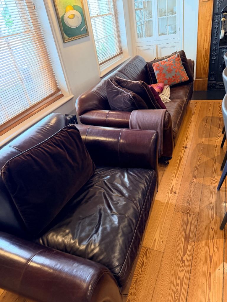 Leather sofa and large armchair set with cushions