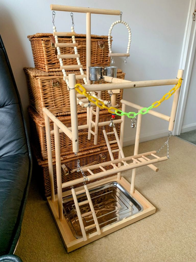 As new, large parrot/bird 4 tier play stand/perches. Cost £44. Wooden