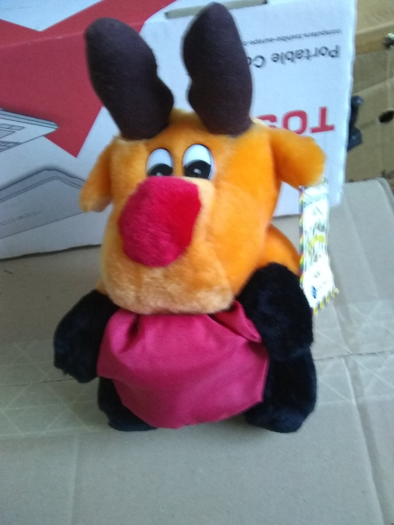 Soft reindeer animal holding red sack - ideal for packaging small present/jewellery 