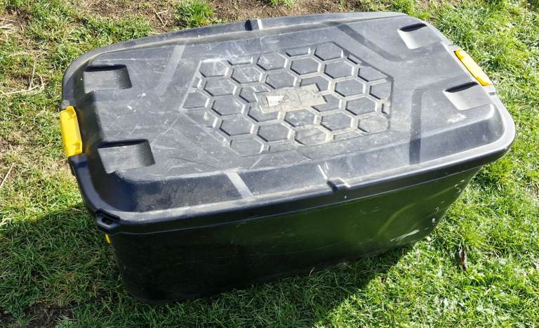 Storage box on wheels with eight dust sheets in