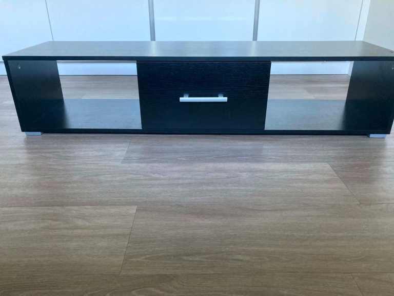 black TV unit stand with storage low style 140cm wide approx.  30.2cm high