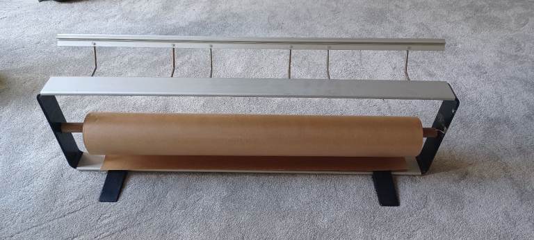 Paper dispenser and roll cutter