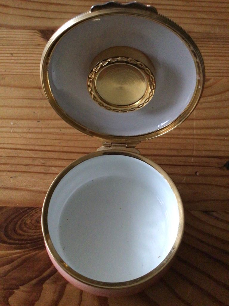 Halcyon Days salmon pink enamel trinket box with inset clock to lid.