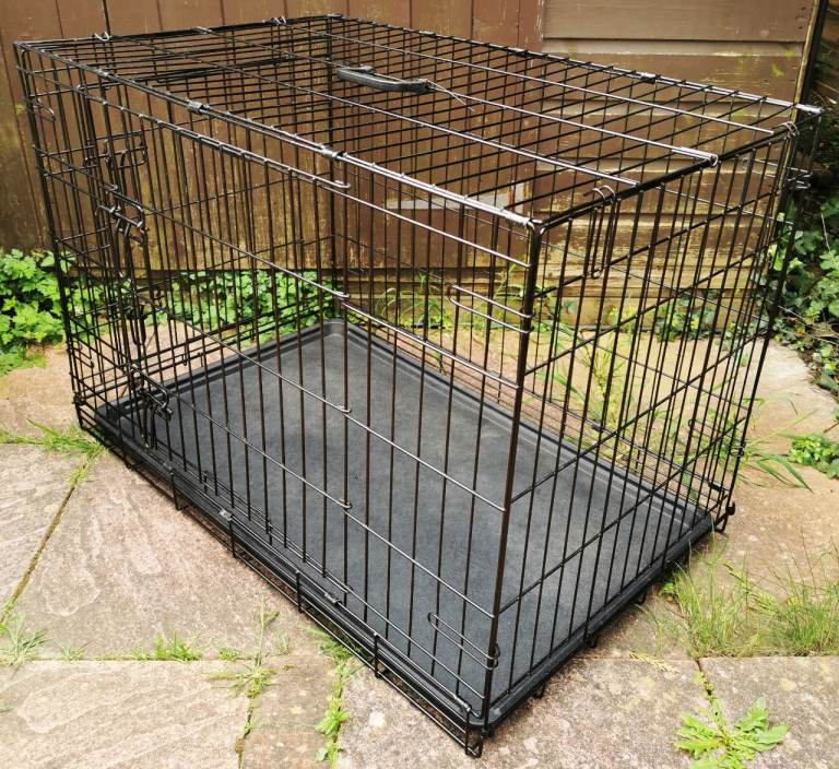 LARGE BLACK STEEL DOG CAGE FOR SALE (Approximate dimensions L. 36  W. 24 H. 25 inches)