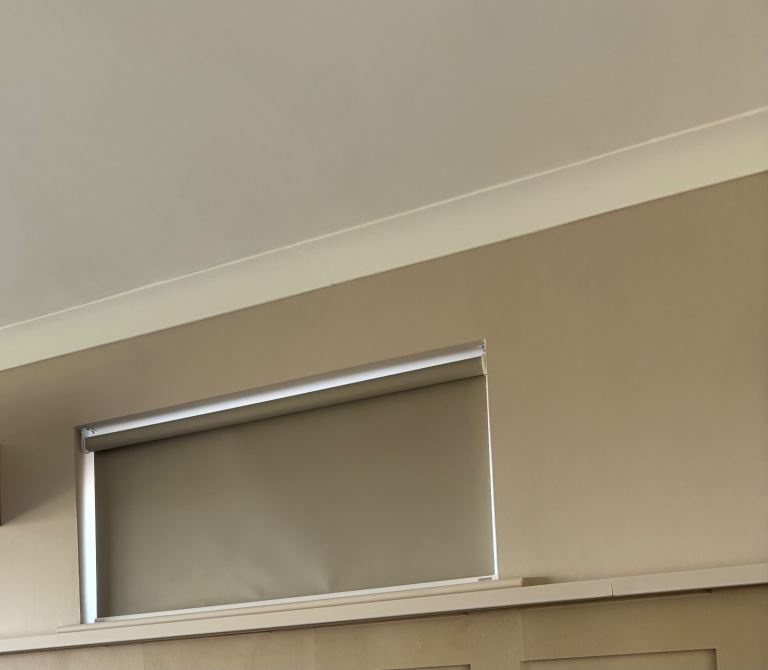 Grey blackout power roller Blind 