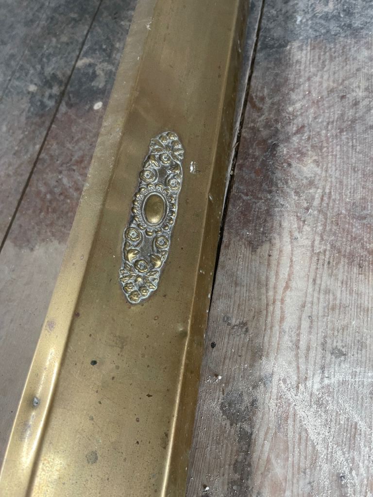 Antique brass fire fender
