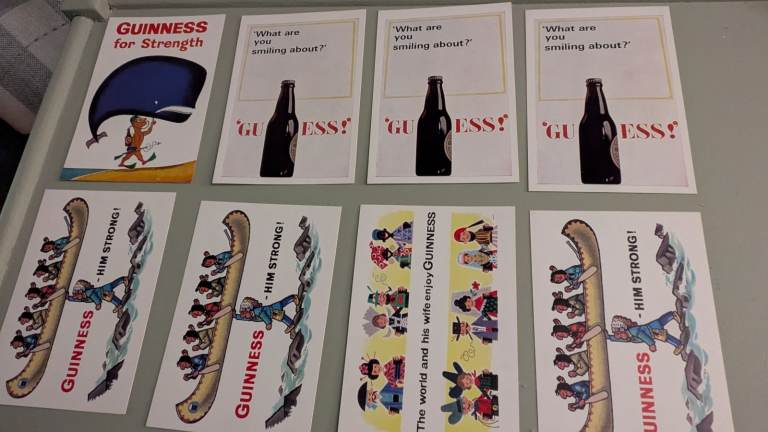 8 various collectable Guinness postcards. 