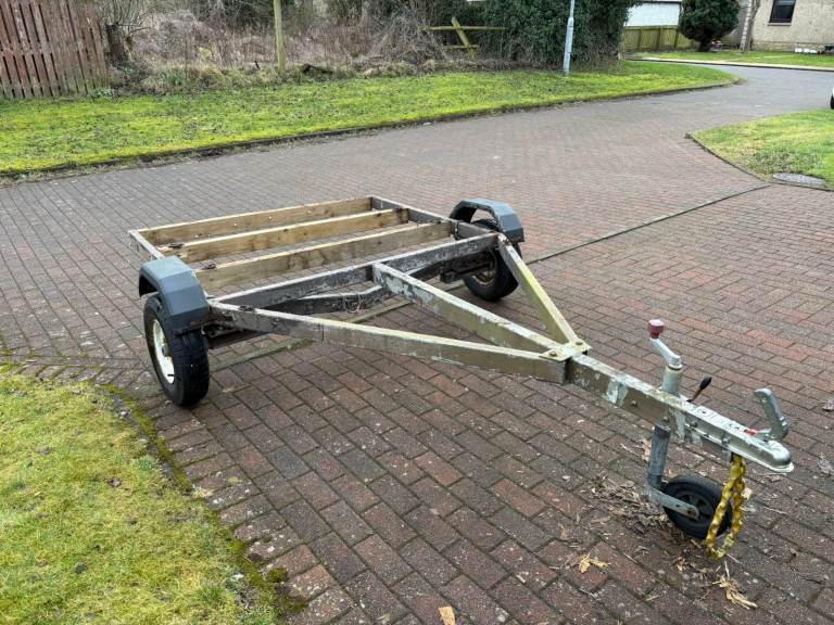 Trailer base, including tie-downs and trailer board