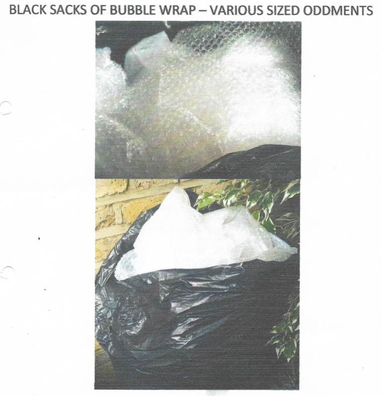 Black sacks of bubble wrap cut offs
