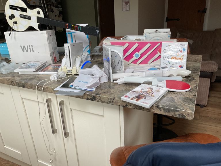Wii console with games and attachments 