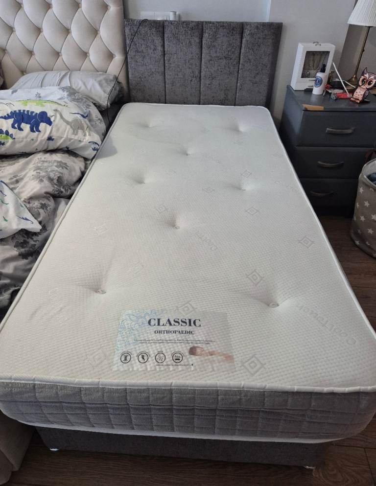 Single bed with headboard and mattress
