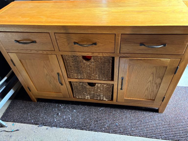 Oak unit with storage baskets and drawers