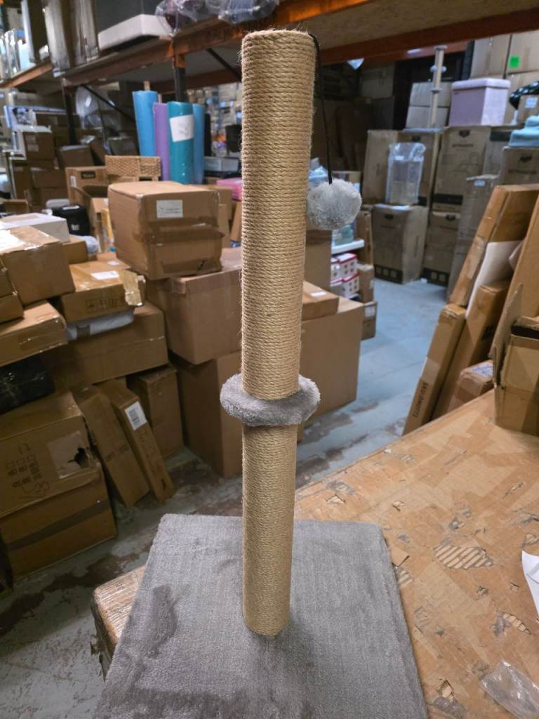 A new cat scratching post it is 74cms hight with 1 pom pom balls it is new 
