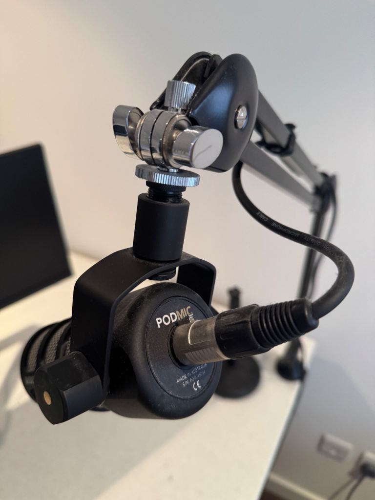RØDE PodMic broadcast microphone with studio arm and stand