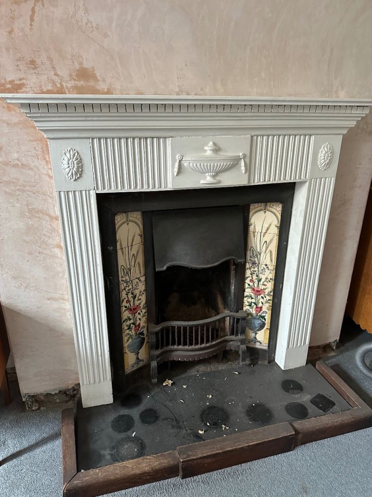 Victorian cast iron fireplace with wooden surround