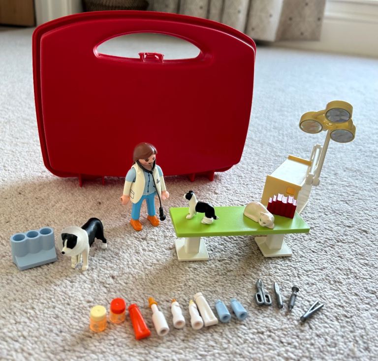Playmobil vet and rabbit sets, with carry cases, in excellent used condition