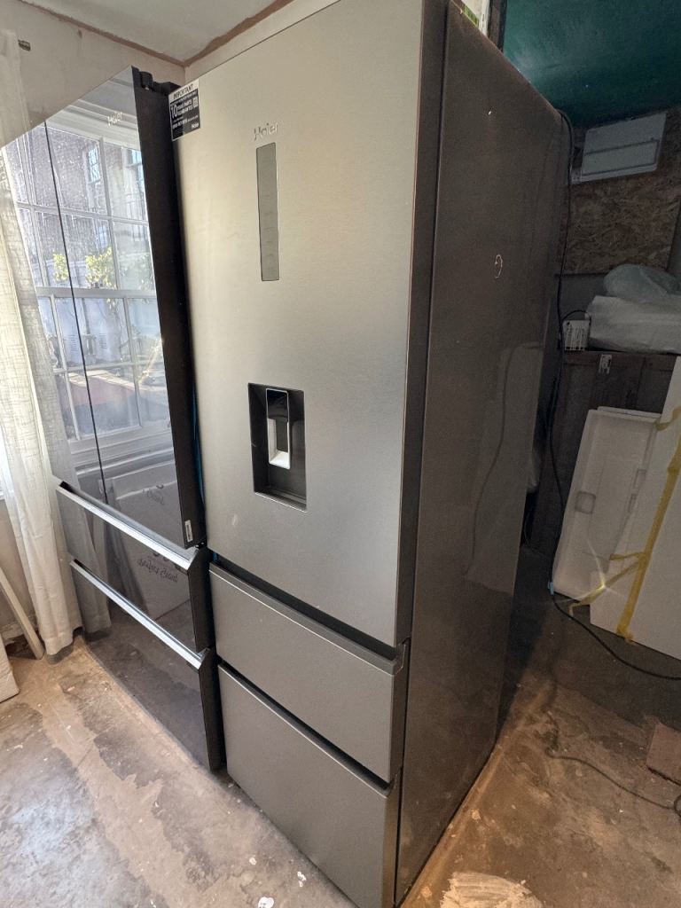 Almost new Haier Fridge Freezer with warranty