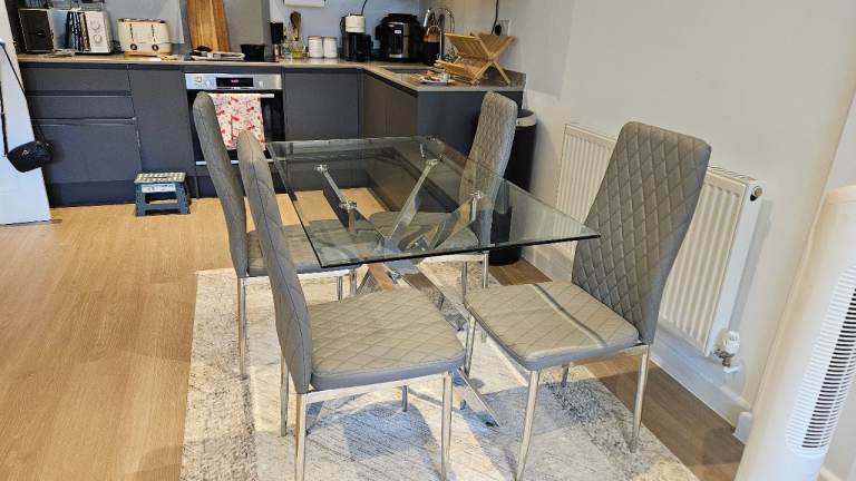 Glass Dining Table Set with 4 Grey Chairs – Fair Condition