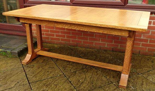 A solid blond oak Art Deco dining table.