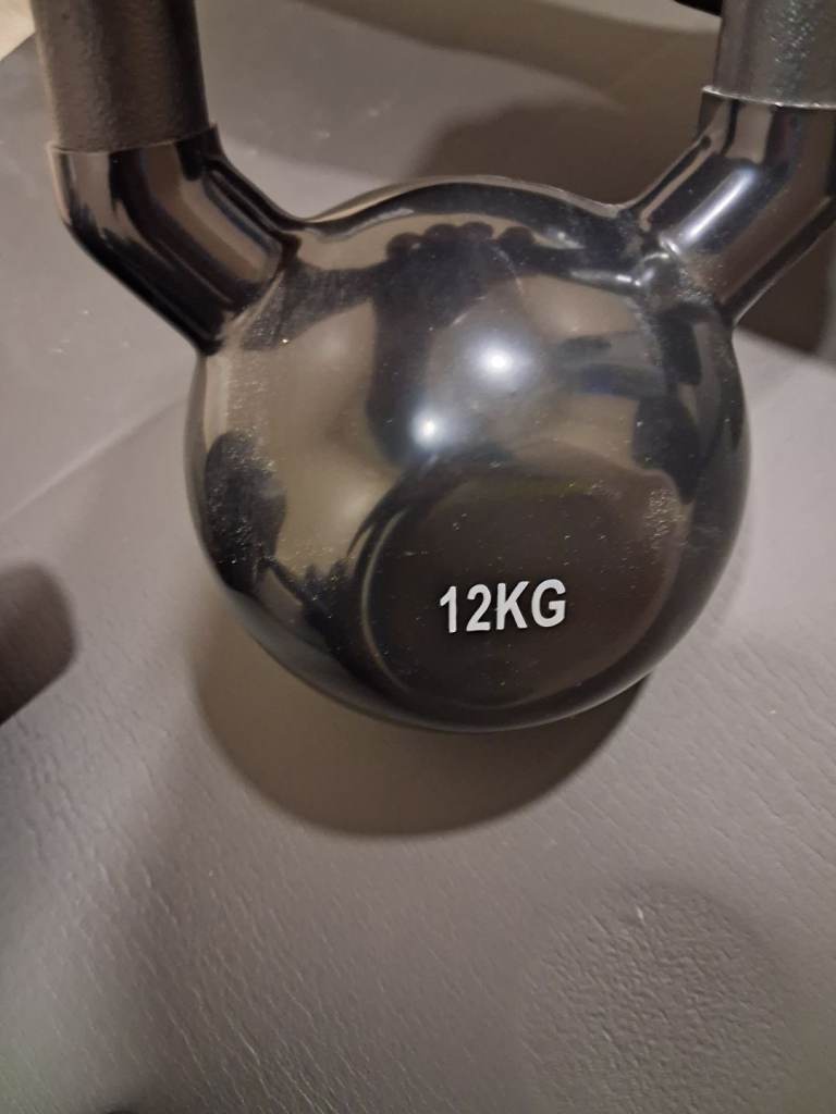 Barbell and dumbell sets with weights and a kettle bell kettlebell