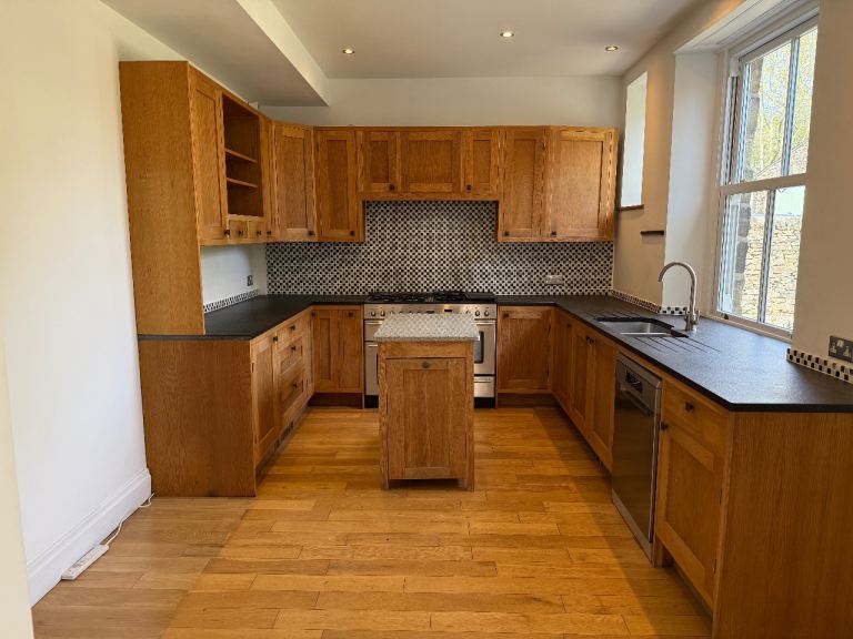 Bespoke wooden kitchen including sink, Rangemaster oven and AEG dishwasher