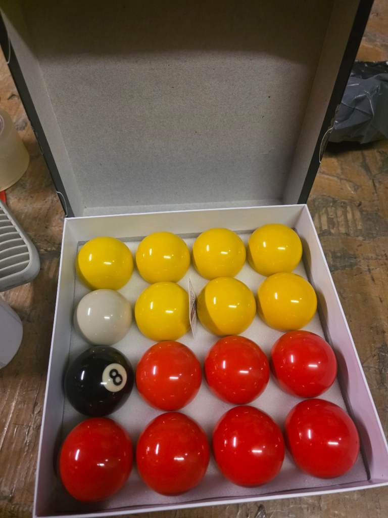 A new still boxed set of 2" pool ball set the r.r.p is 17.99 we are selling them for 9.00 .