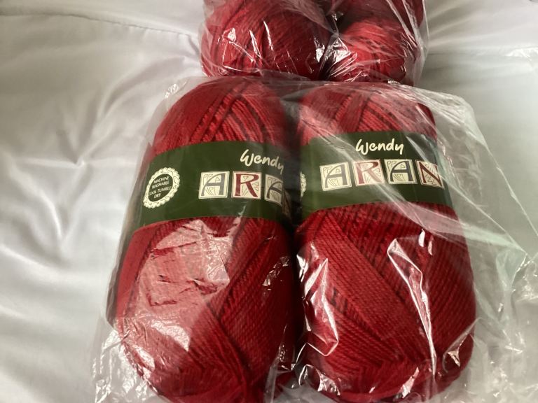 A bundle of Wendy Aran wool yarn in various colours
