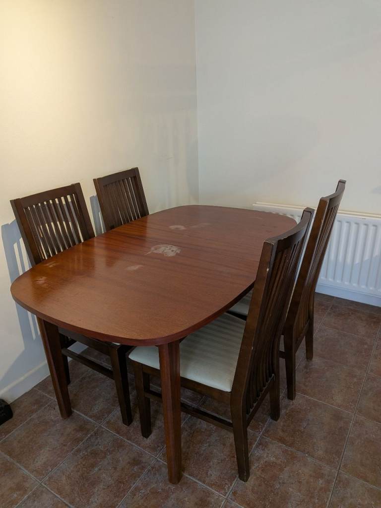 Dining table and 4 high back chairs.