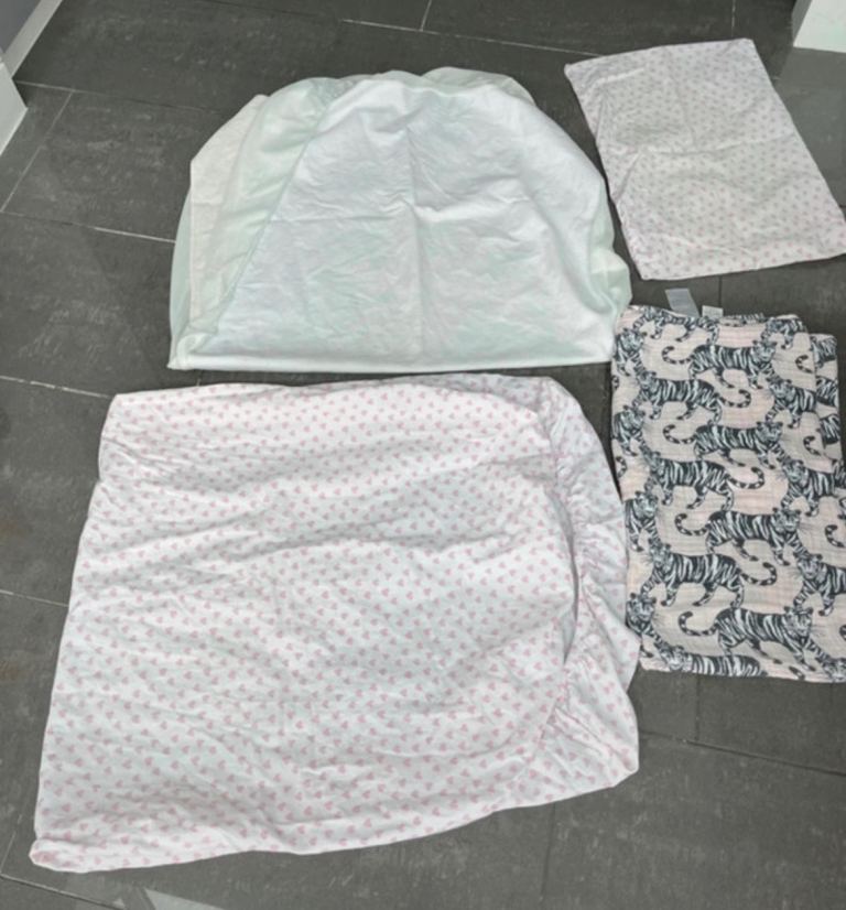 Cot bedding fitted mattress protector, fitted sheet and pillow cover and a muslin sheet 