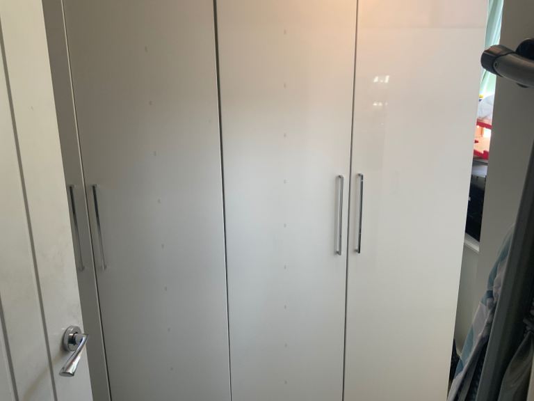 Two White Gloss wardrobes and Drawer Unit / Small Cabinet