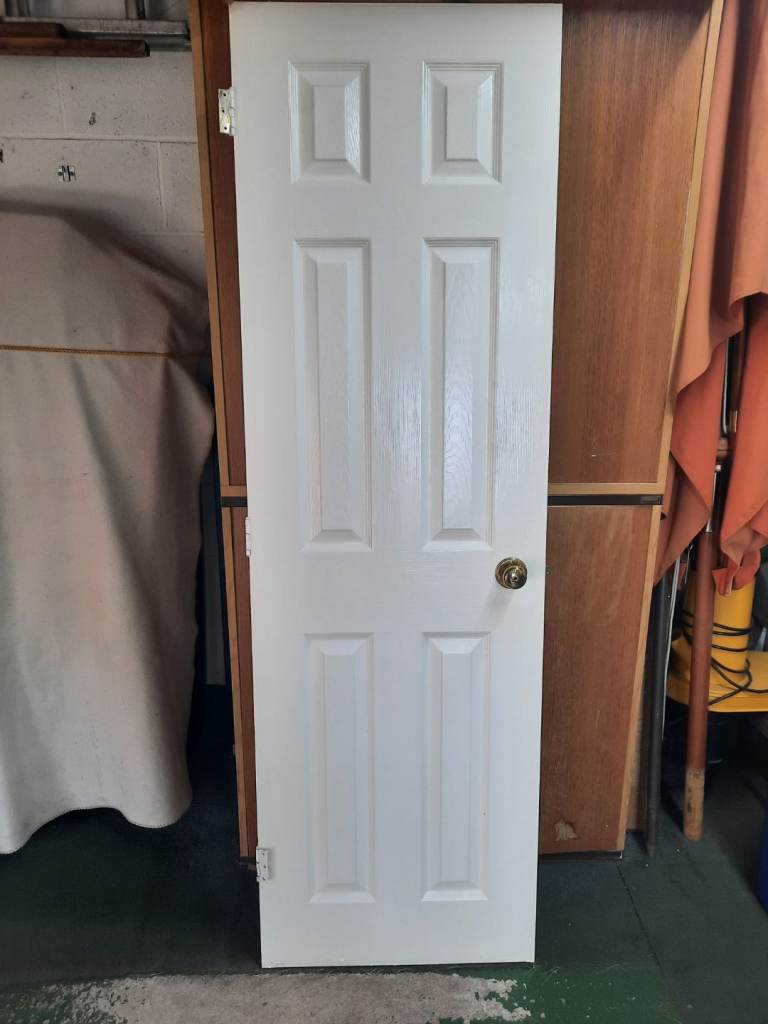 White Six-Panel Interior Door with Brass Handle