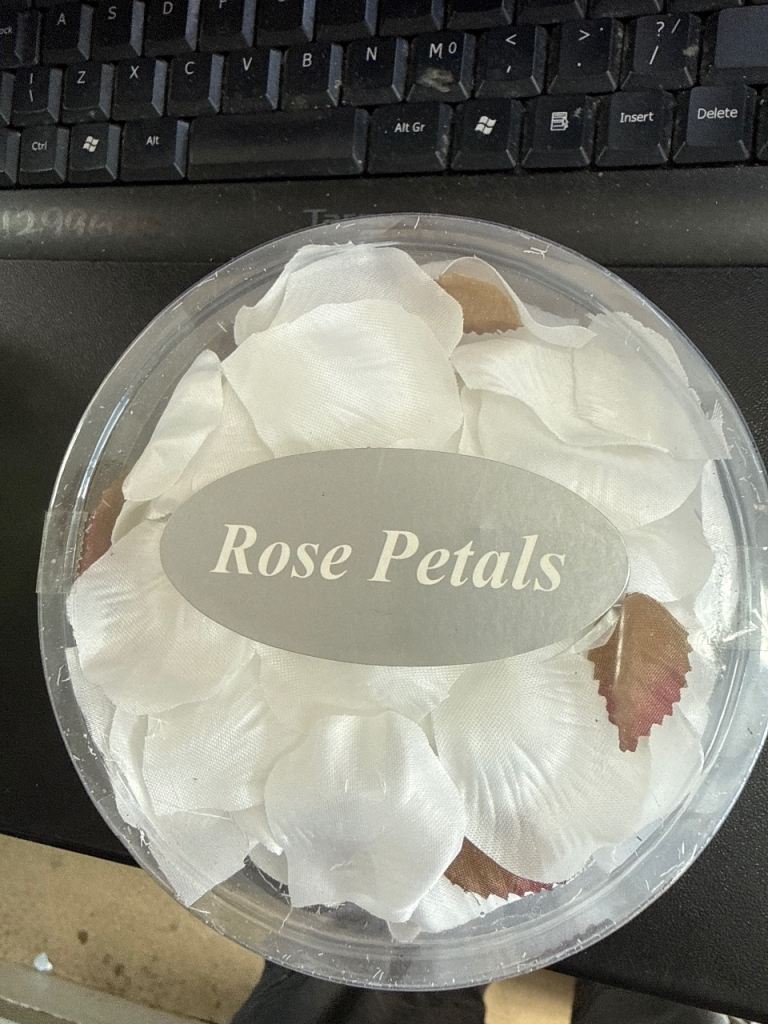 New White Rose Petals in Container