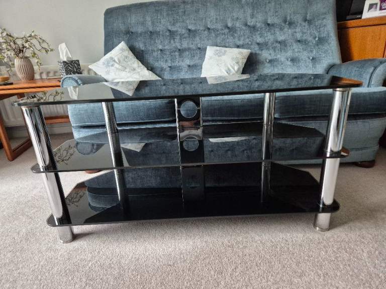 Black glass and chrome TV stand - 105cm wide x 45cm deep x 52.5cm tall