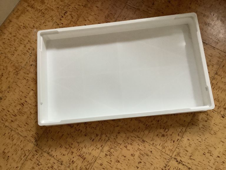Large white plastic catering trays