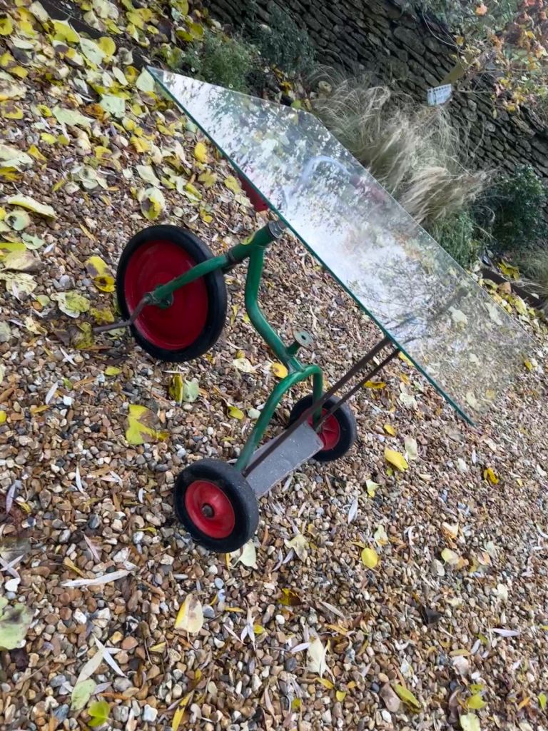 Vintage unique glass coffee table with tricycle base