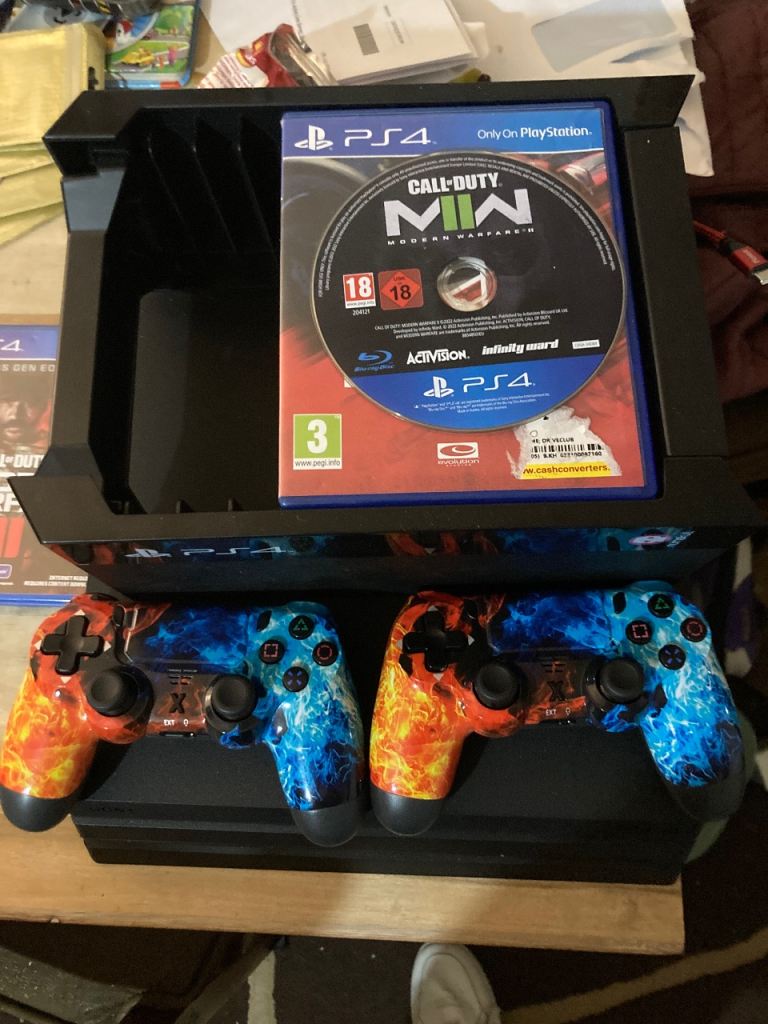 PS4  pro 1tbConsole with 2 Custom Controllers and Call of Duty MW2 Game