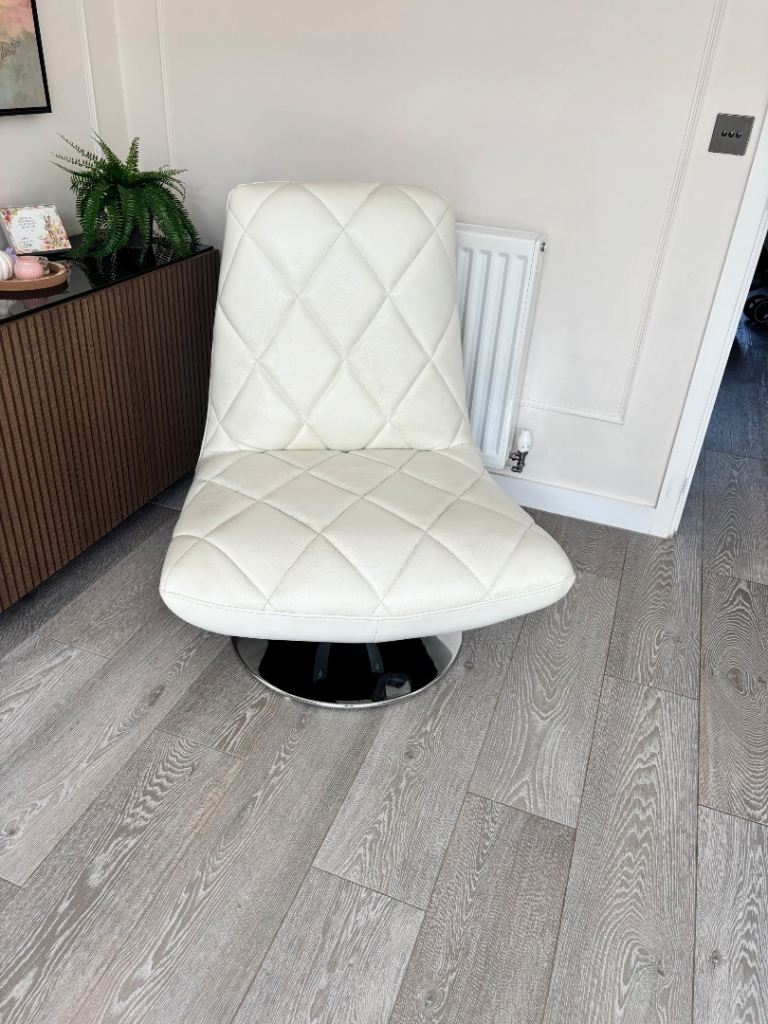 White leather spinning chair