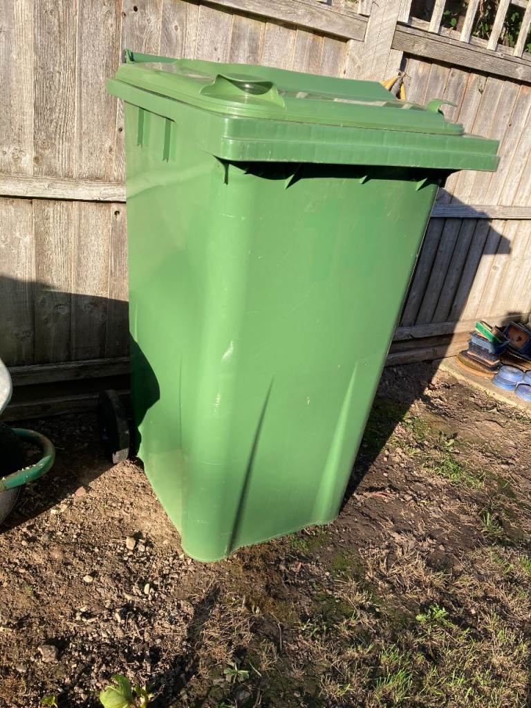 Green wheelie bin, full size, like new.