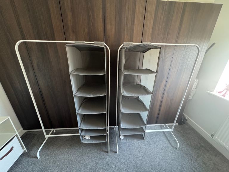 2x clothing rails with storage compartments