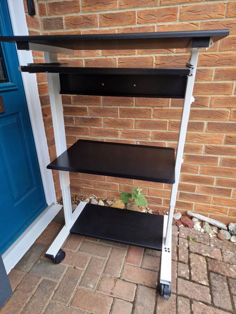 Desk - adjustable height for sitting or standing with keyboard shelf