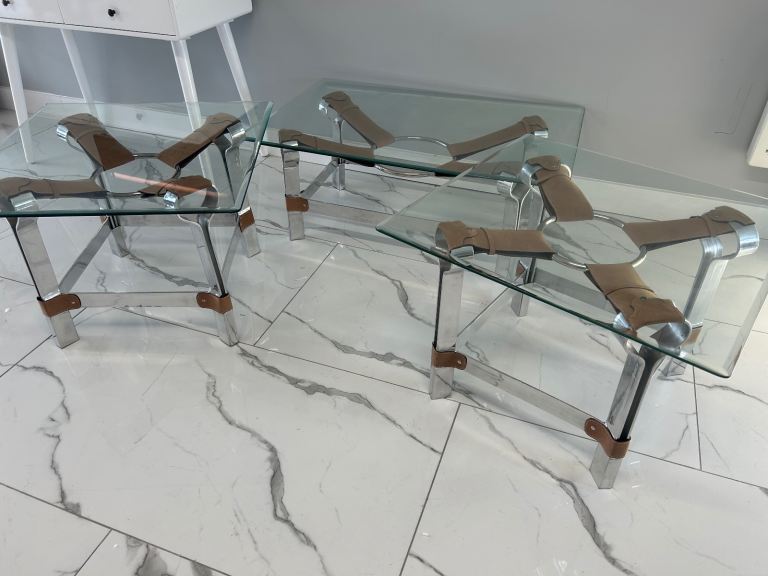 Three glass topped tables by James Brindley of Harrogate