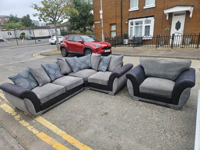 DFS black and grey fabric corner sofa with matching armchair 