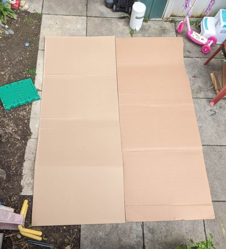 Two large pieces of cardboard.