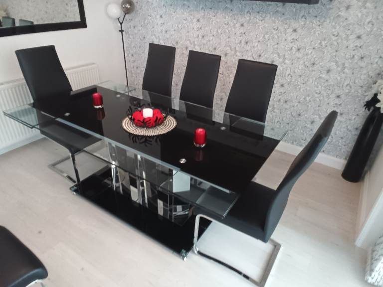 Oblong glass dining table and 8 chairs