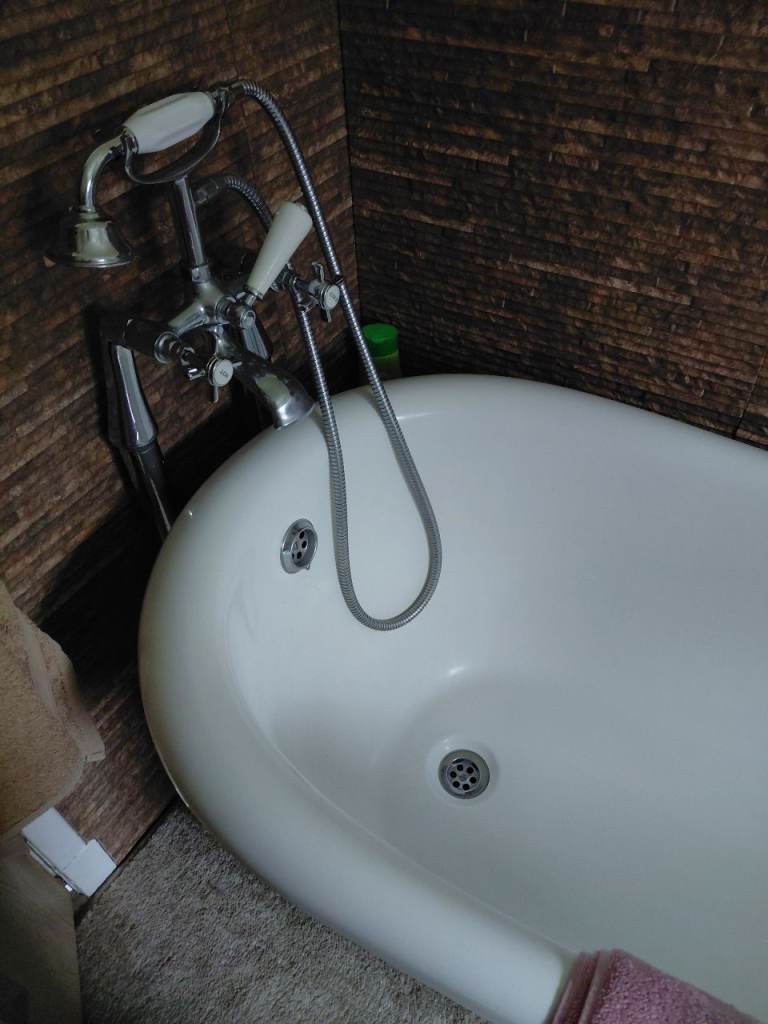 Free standing bath with shower attachments 