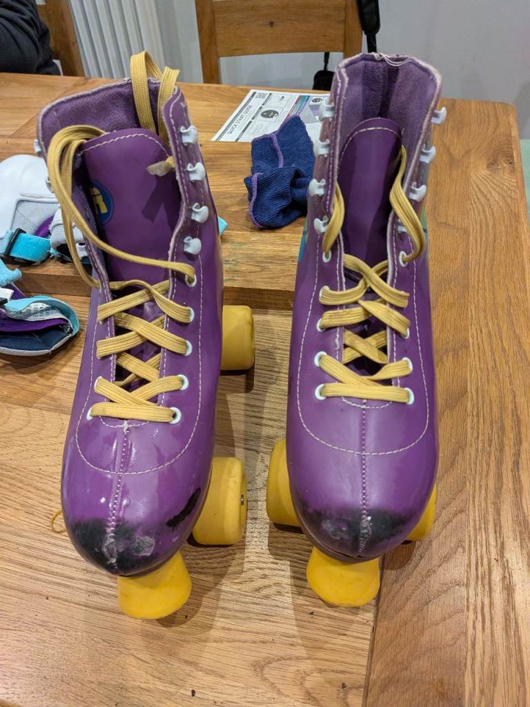 Purple Rookie Adjustable roller skates (size 3-5)